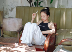 Woman writing with an apple pencil on an ipad, brainstorming